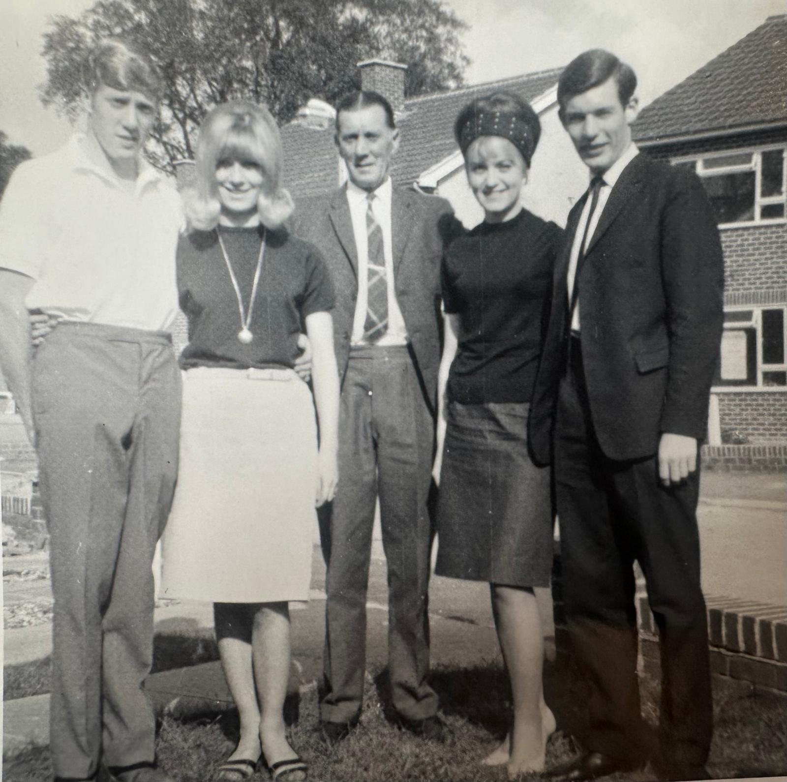 Black and white family group photograph outdoors