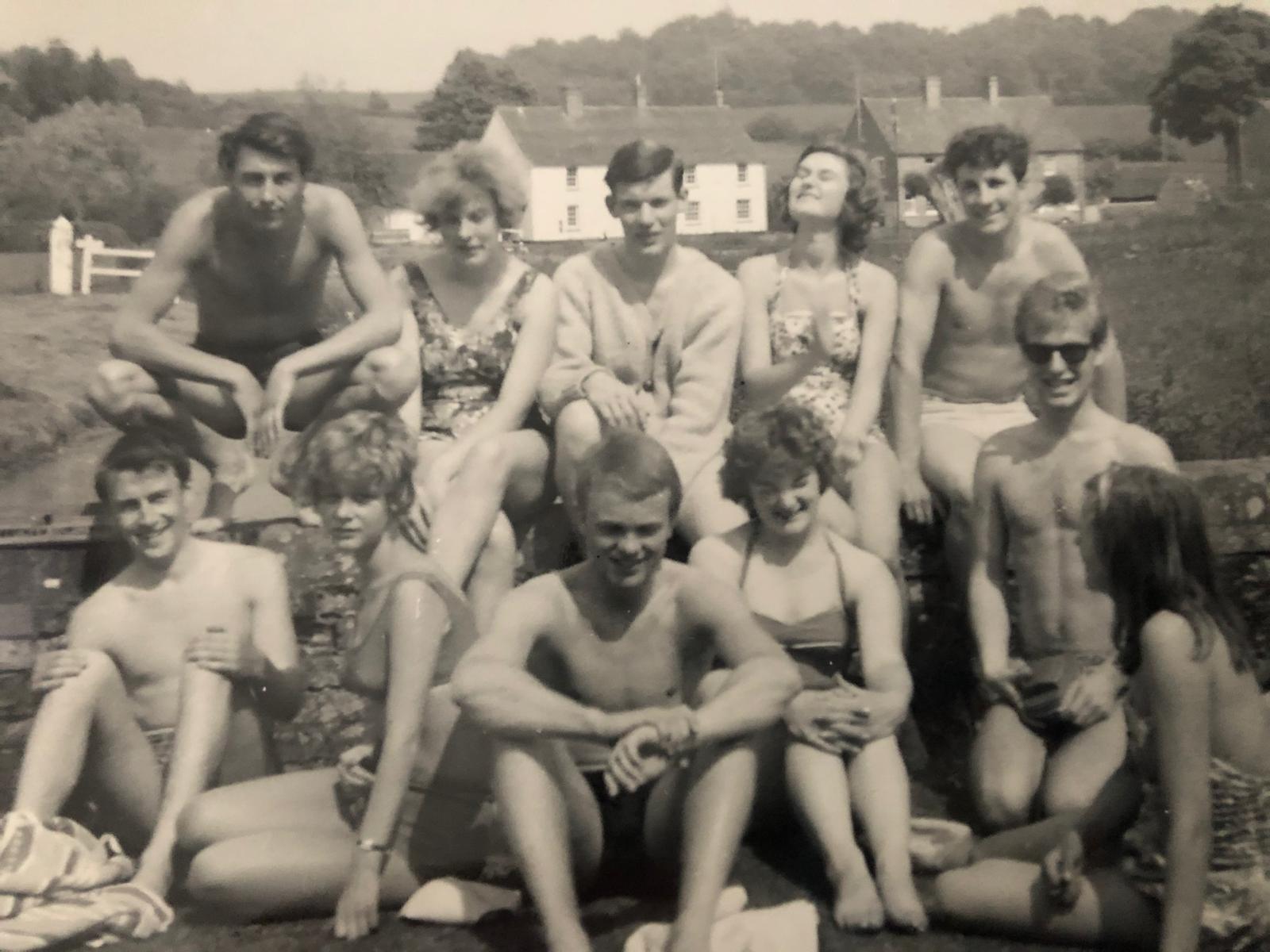 Black and white group photograph outdoors in summer