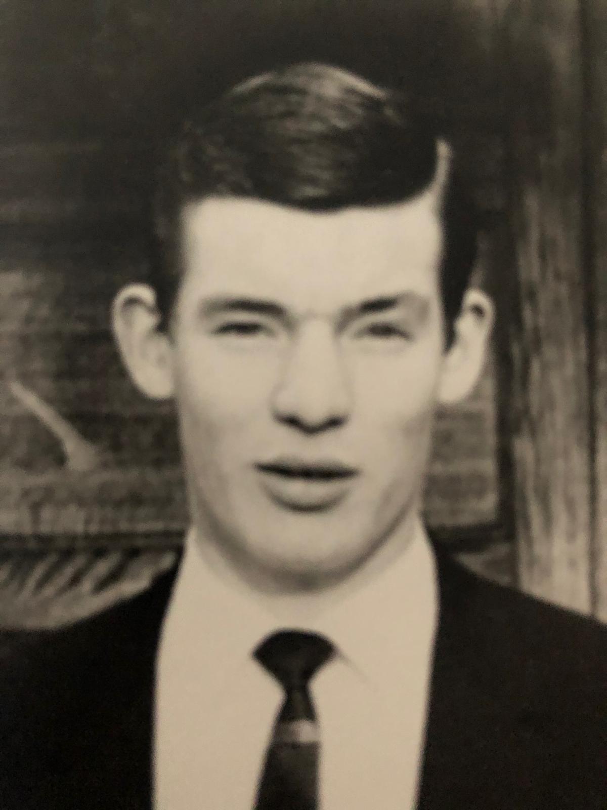 Portrait of David John Edwards wearing a suit and tie